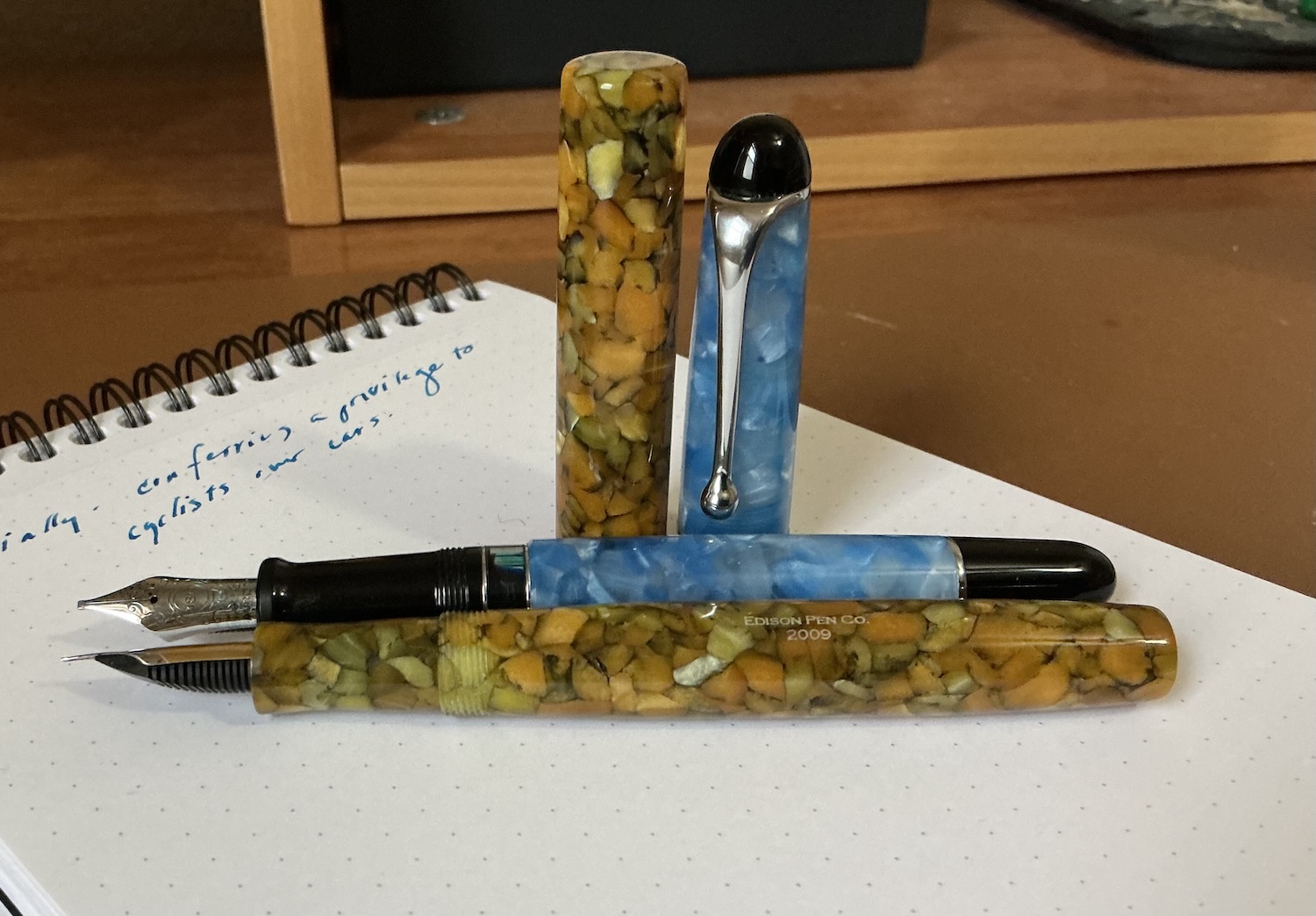 uncapped Edison Huron in Yellowstone next to uncapped Aurora 88 in light blue marble Alt text